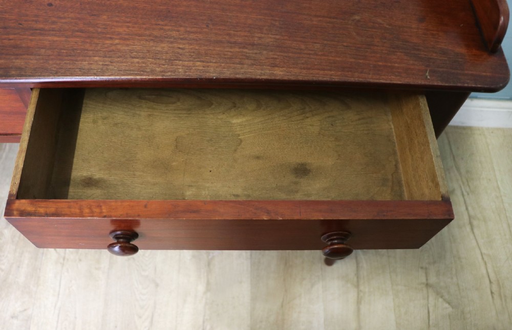 A lovely Victorian mahogany table later sign written booking office. View XVIII