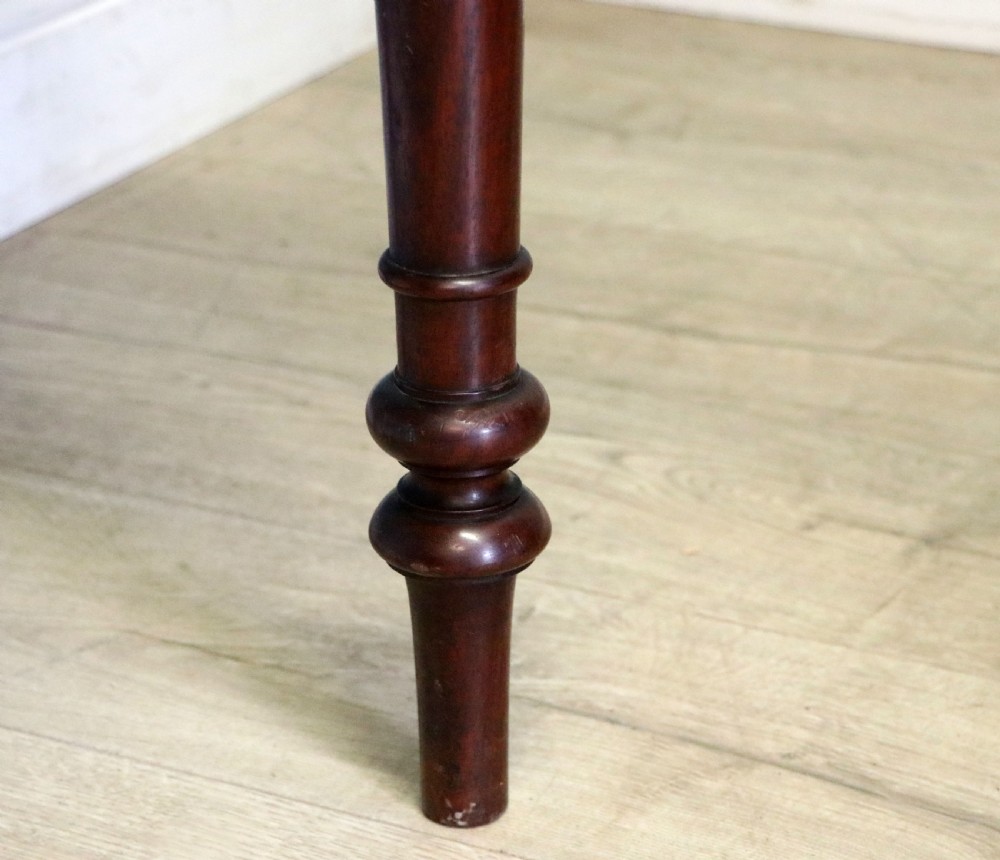A lovely Victorian mahogany table later sign written booking office. View XX