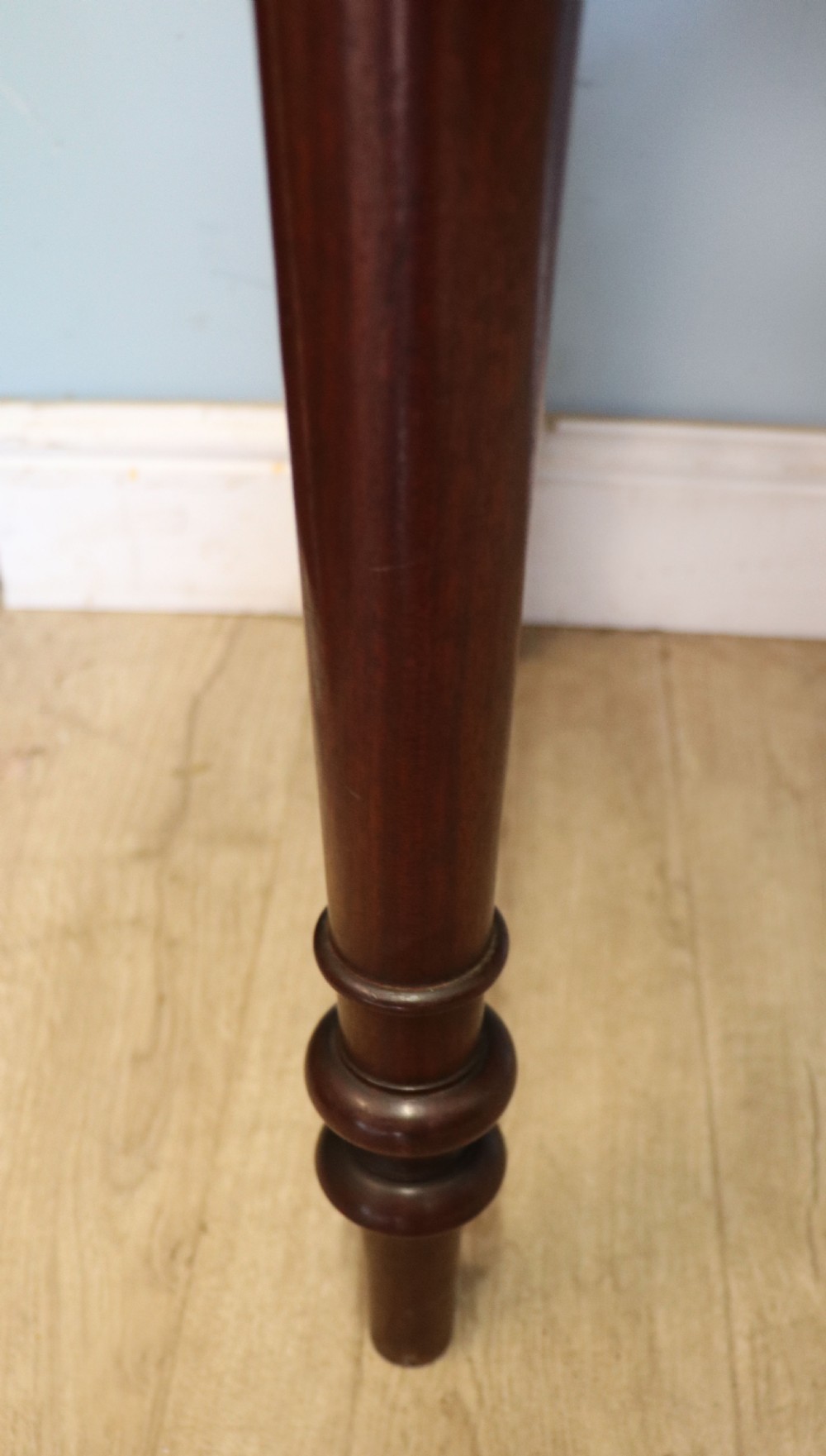 A lovely Victorian mahogany table later sign written booking office. View XXI