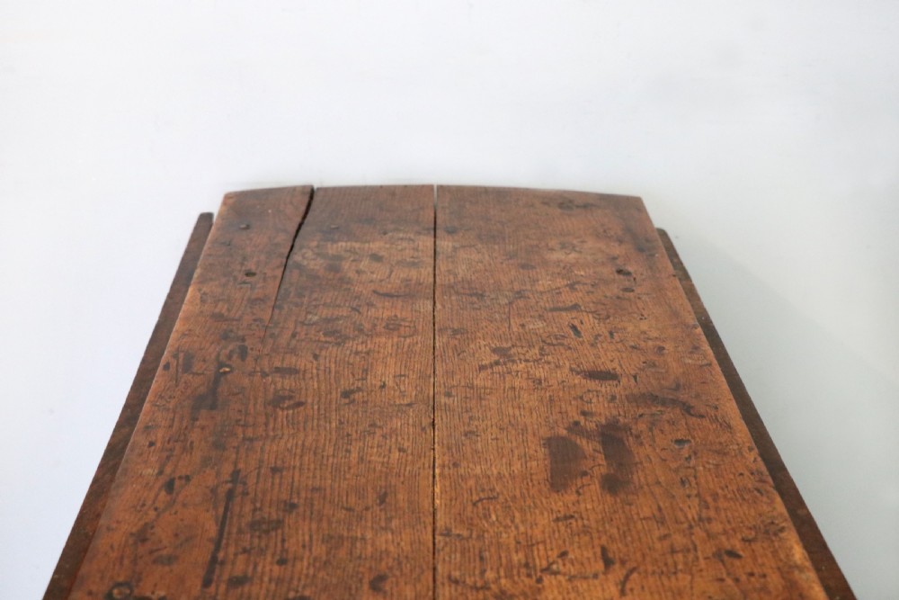 A lovely 18th century English oak drop leaf dining table. View X