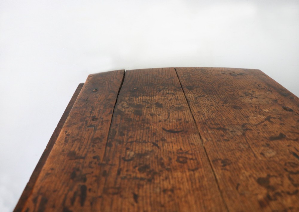 A lovely 18th century English oak drop leaf dining table. View XII