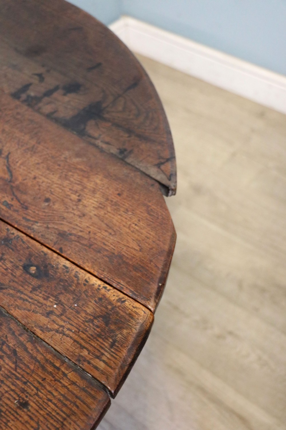 A lovely 18th century English oak drop leaf dining table. View XIV