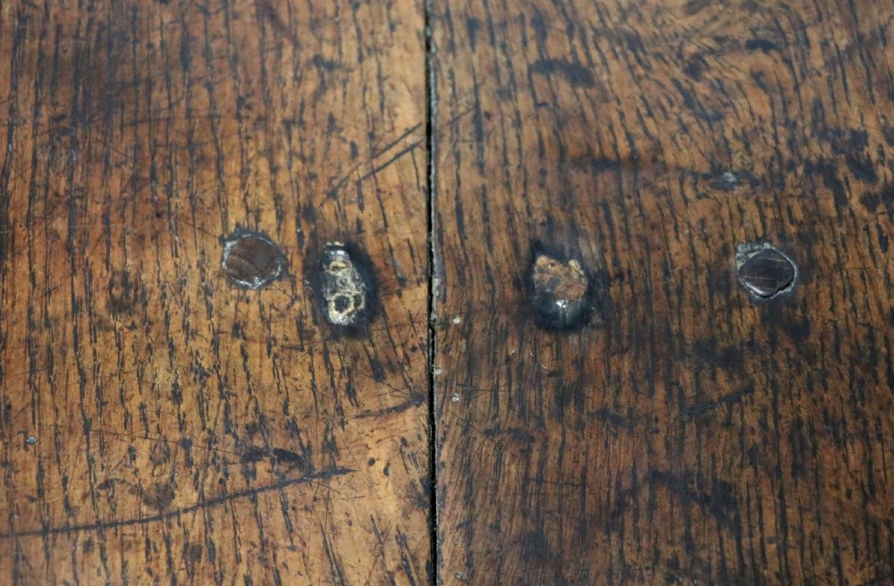 A lovely 18th century English oak drop leaf dining table. View XVI