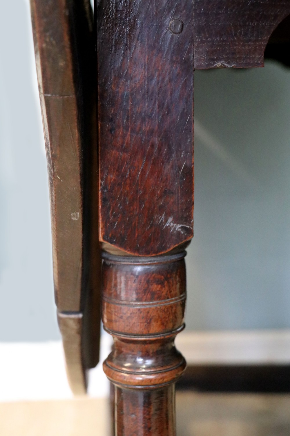 A lovely 18th century English oak drop leaf dining table. View XIX
