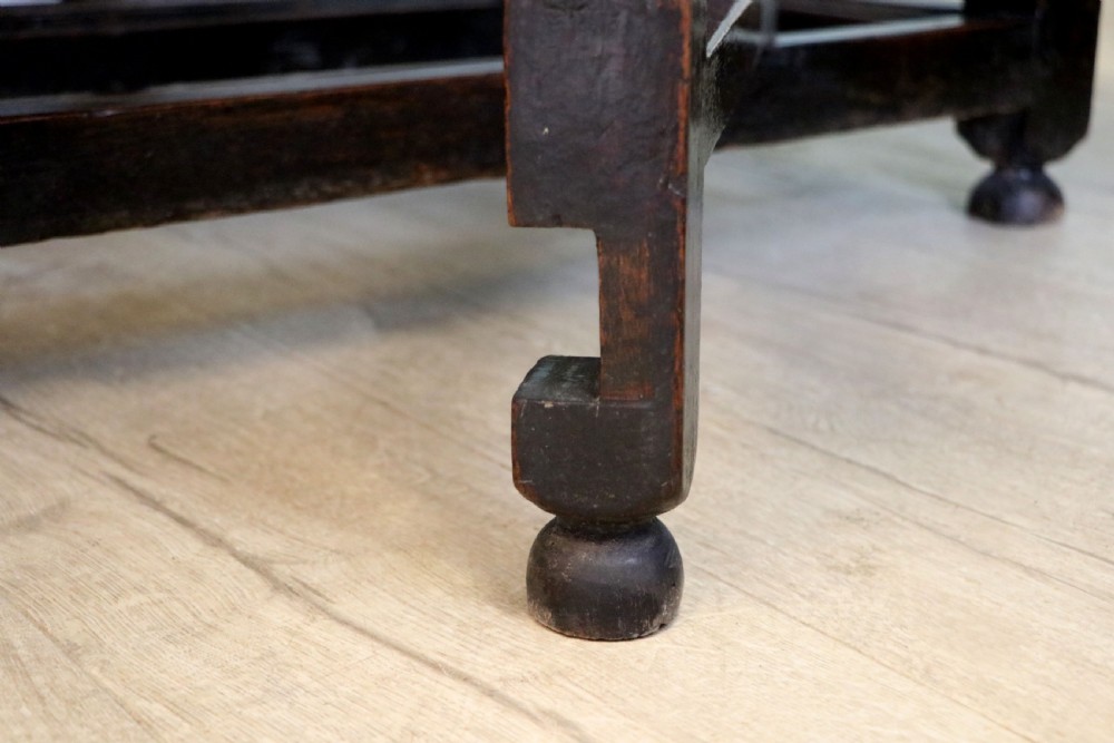 A lovely 18th century English oak drop leaf dining table. View XXII