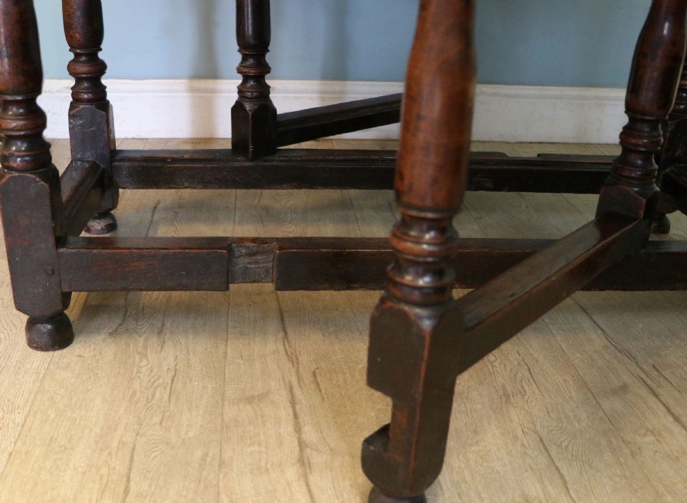 A lovely 18th century English oak drop leaf dining table. View XXIV