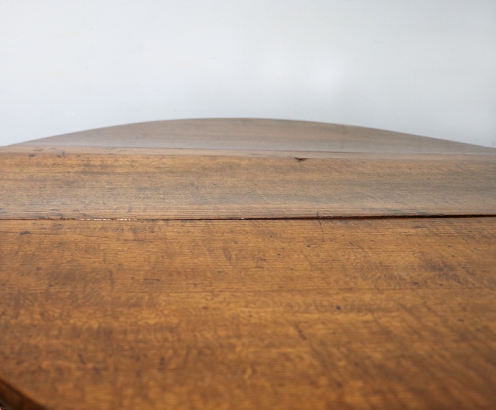 A lovely 18th century English oak drop leaf dining table.  View XIII