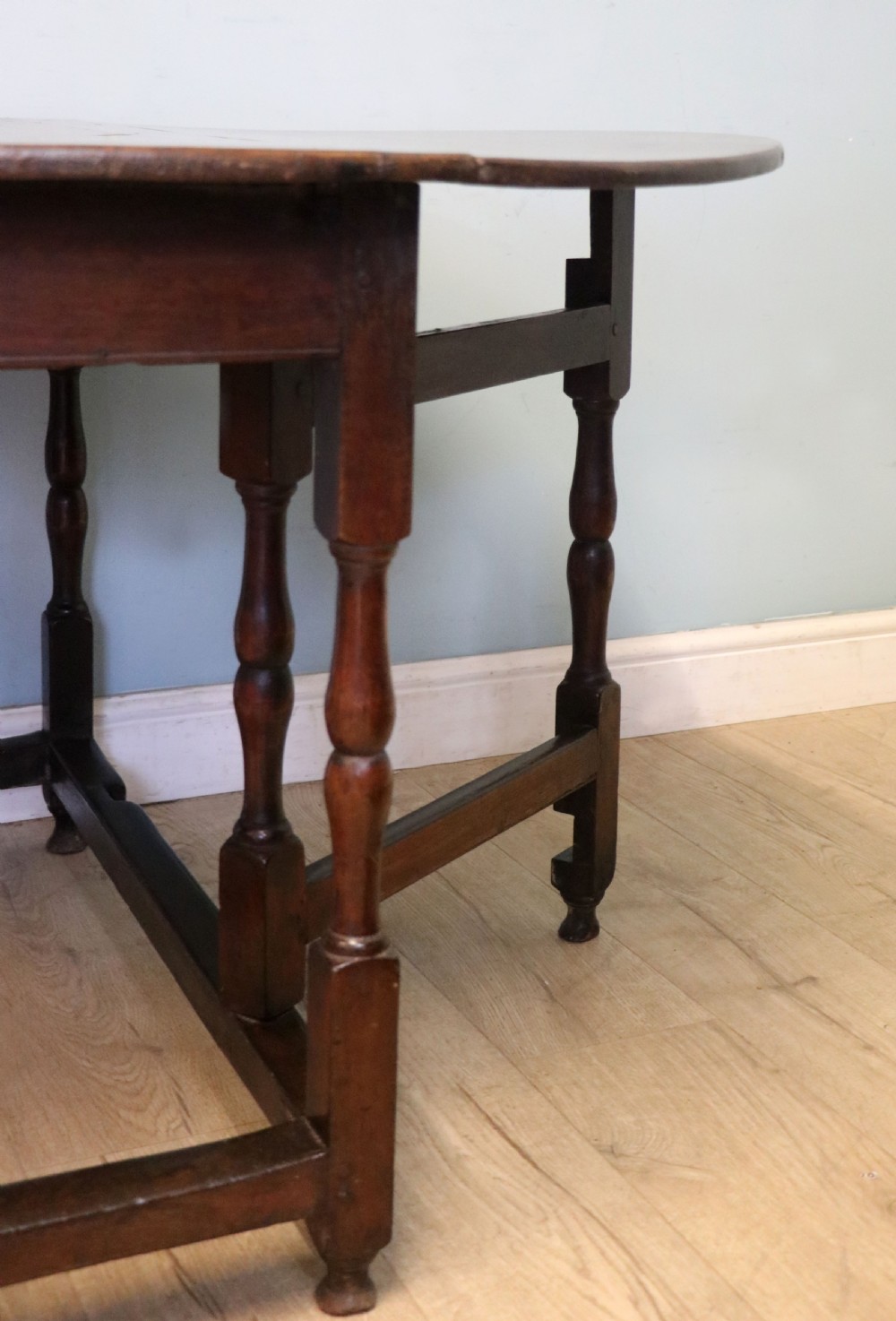 A lovely 18th century English oak drop leaf dining table.  View XX