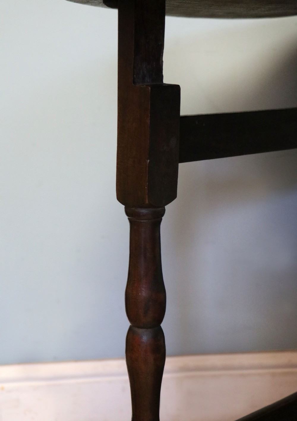 A lovely 18th century English oak drop leaf dining table.  View XXI
