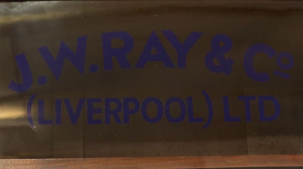 A late 19th-century walnut glazed display cabinet featuring two glass doors decorated with gilded signwriting above two drawers and a panelled base cupboard. View III