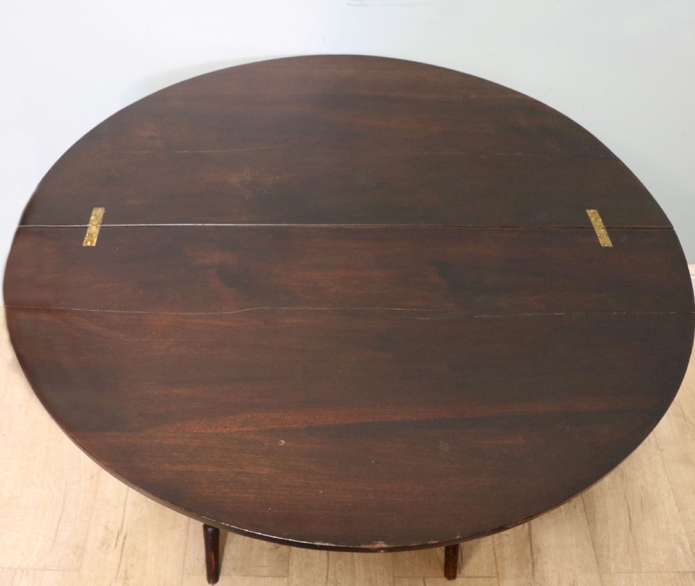 A early 20th century mahogany coaching or campaign table bearing a label for Thornton and Herne of Pont Street, London.  View II