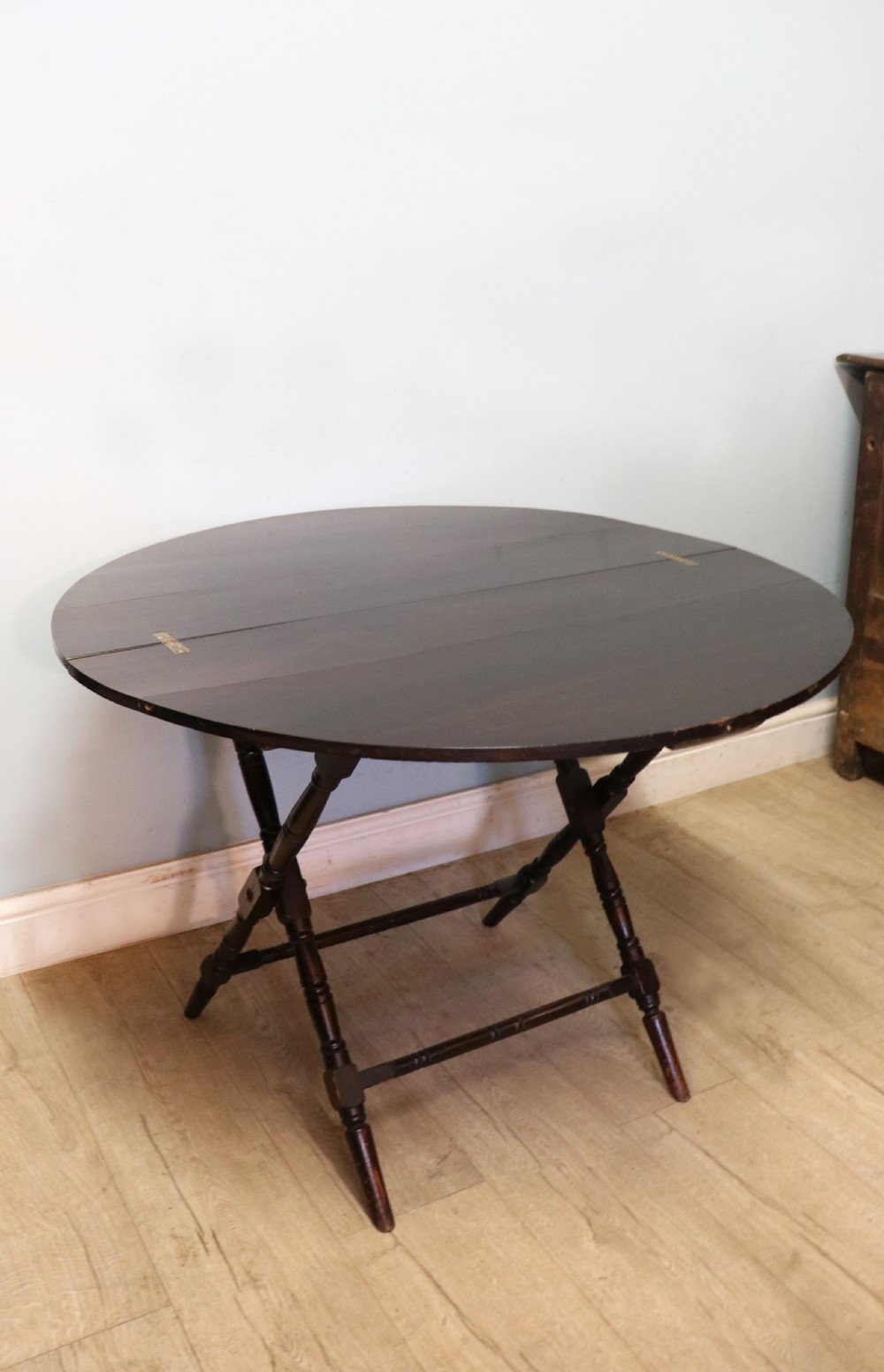 A early 20th century mahogany coaching or campaign table bearing a label for Thornton and Herne of Pont Street, London.  View III