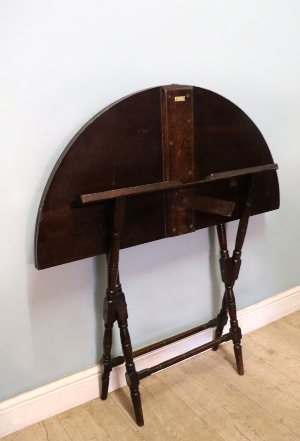 A early 20th century mahogany coaching or campaign table bearing a label for Thornton and Herne of Pont Street, London.  View V