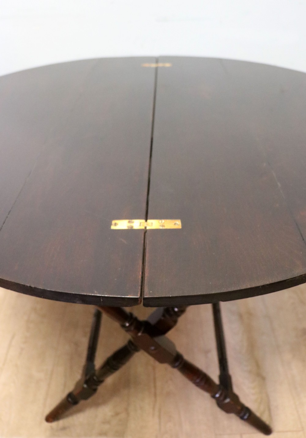 A early 20th century mahogany coaching or campaign table bearing a label for Thornton and Herne of Pont Street, London.  View VI