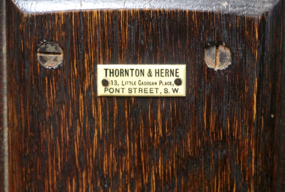 A early 20th century mahogany coaching or campaign table bearing a label for Thornton and Herne of Pont Street, London.  View VIII