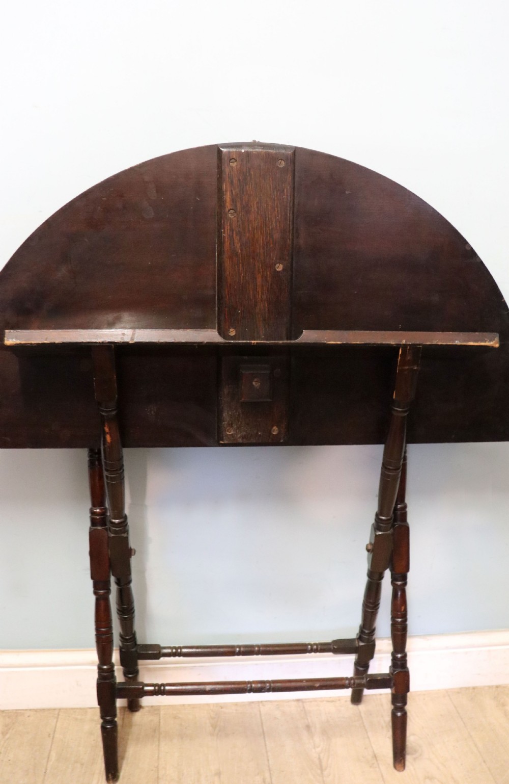A early 20th century mahogany coaching or campaign table bearing a label for Thornton and Herne of Pont Street, London.  View X