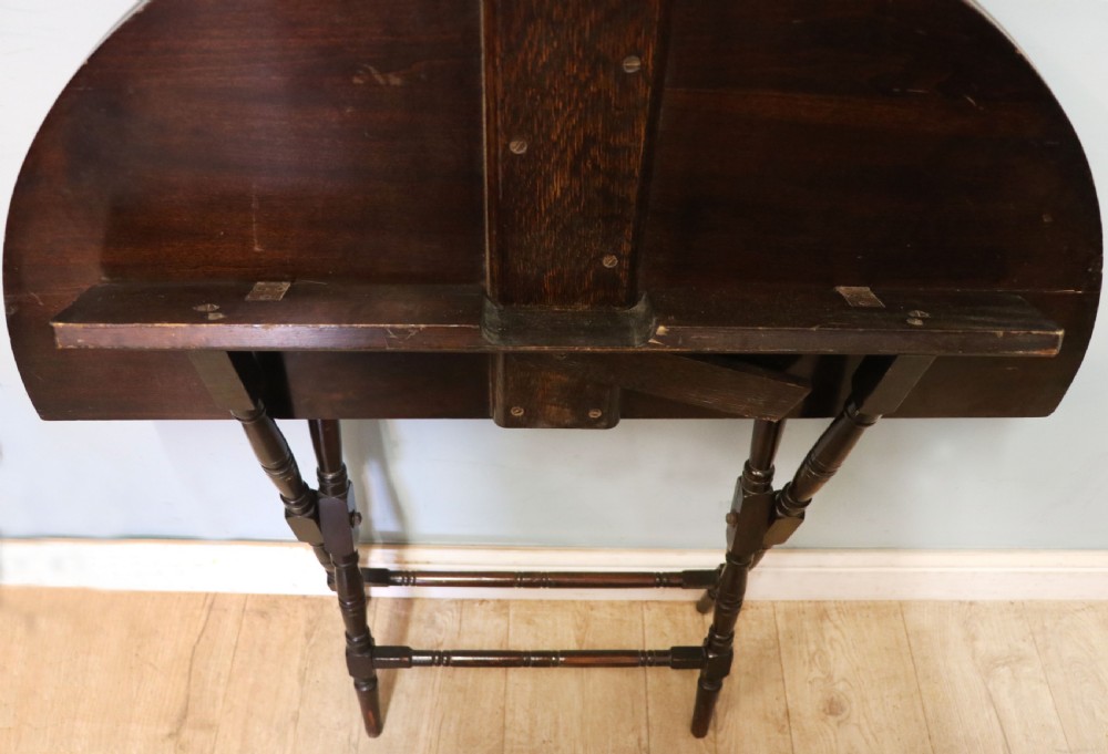 A early 20th century mahogany coaching or campaign table bearing a label for Thornton and Herne of Pont Street, London.  View XI