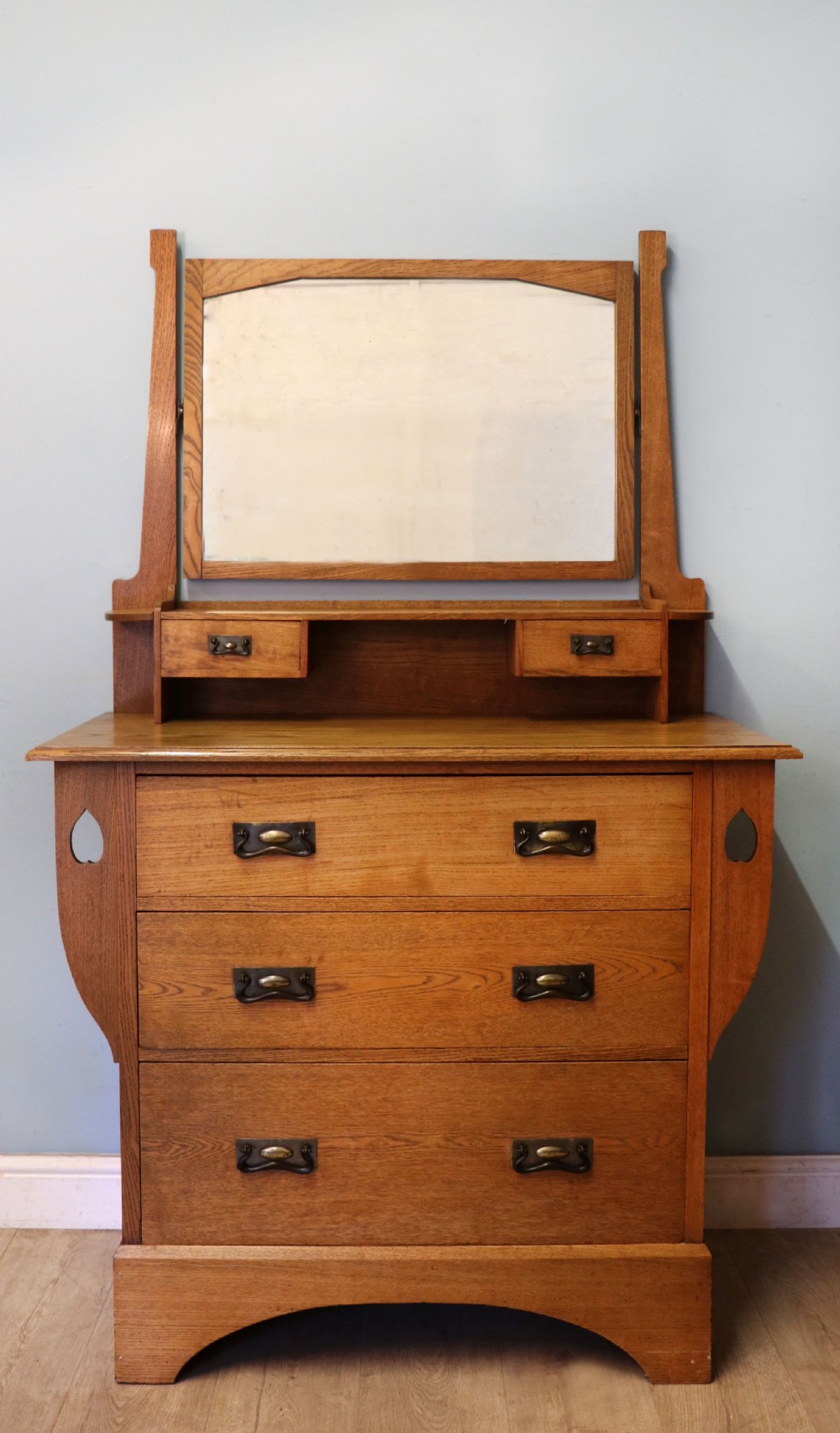A lovely late 19th century light oak dressing chest