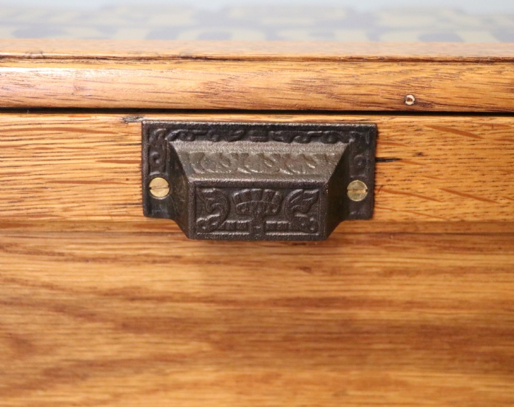 An early 20th-century oak countertop display cabinet featuring glazed panels and gold sign-written Cadburys Dairy Milk Chocolate lettering. View XXVII