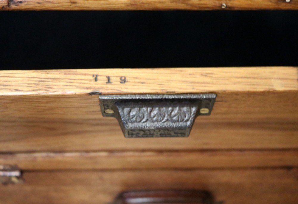 An early 20th-century oak countertop display cabinet featuring glazed panels and gold sign-written Cadburys Dairy Milk Chocolate lettering. View XXX