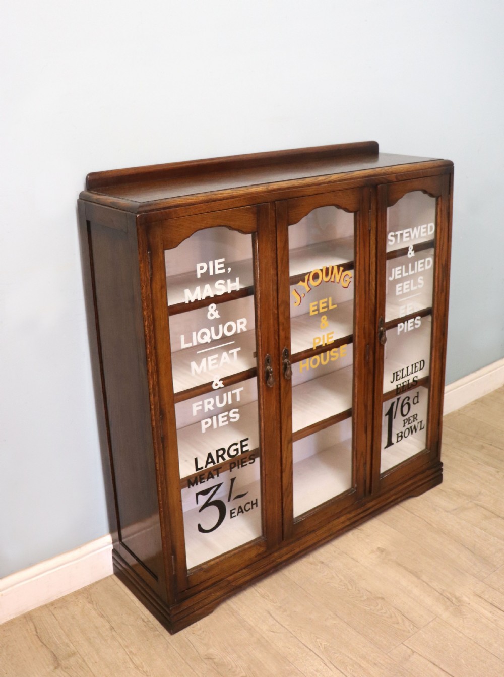  A lovely solid 1930s oak framed later sign written display cabinet. View III