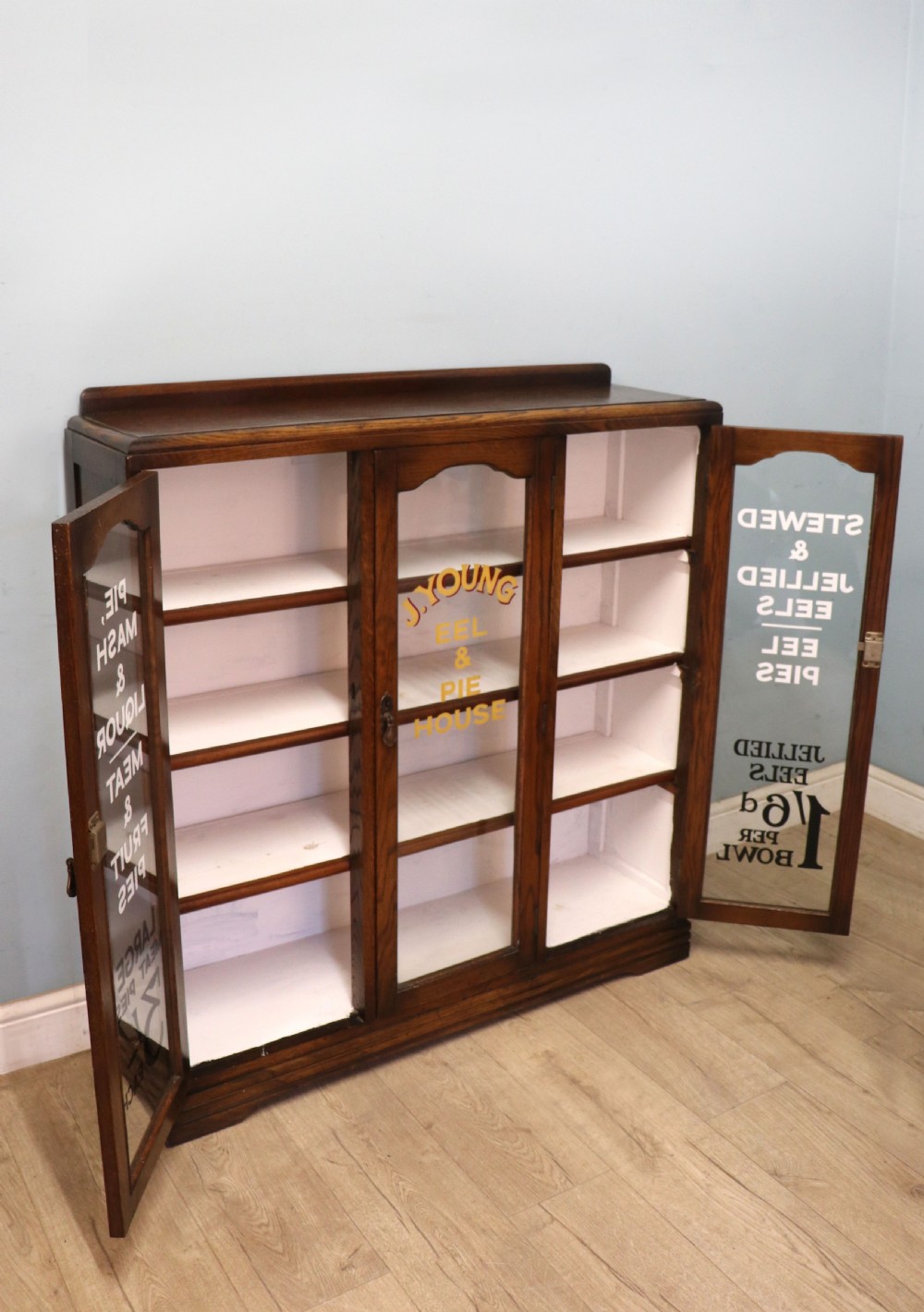  A lovely solid 1930s oak framed later sign written display cabinet. View IV