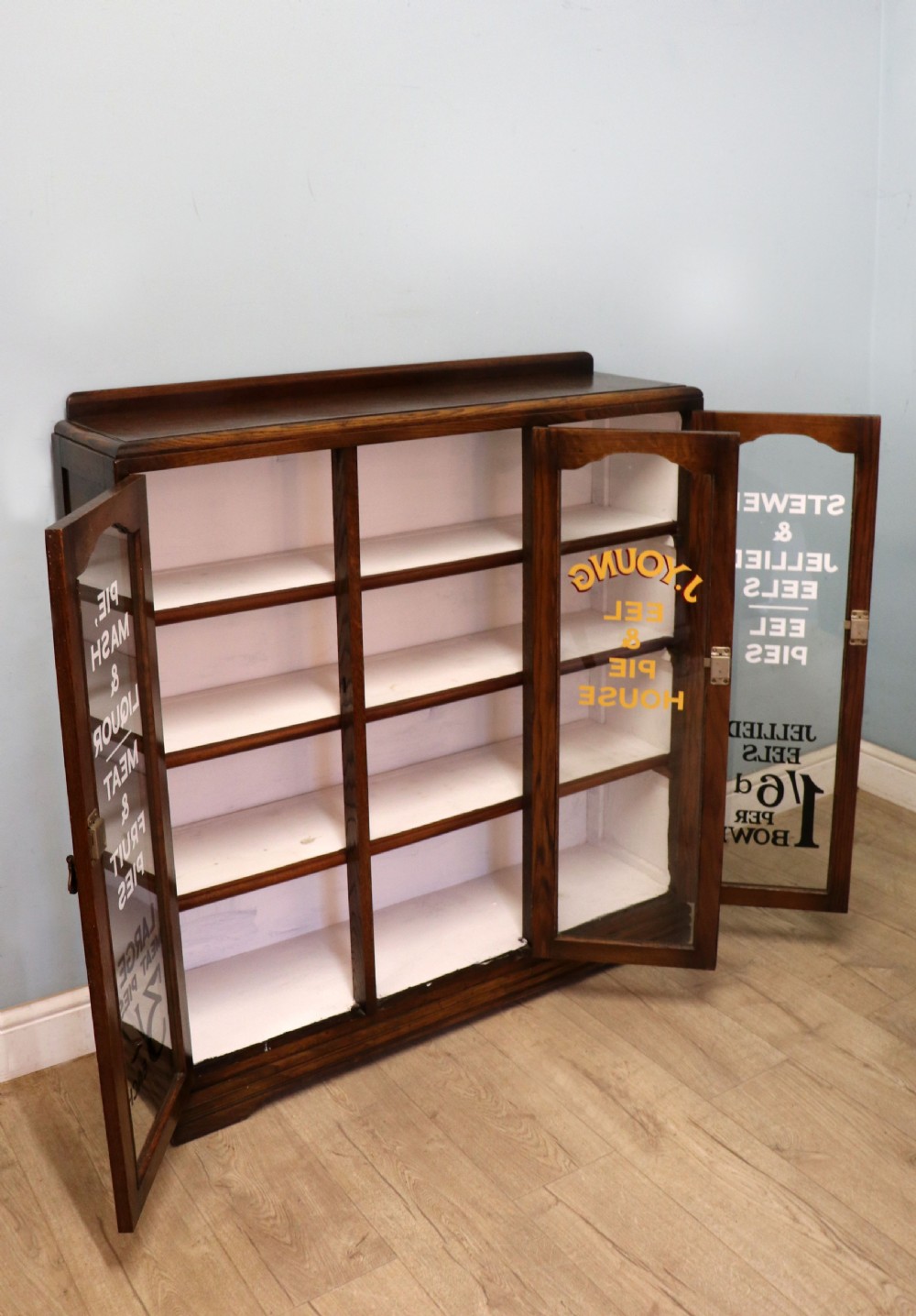  A lovely solid 1930s oak framed later sign written display cabinet. View V