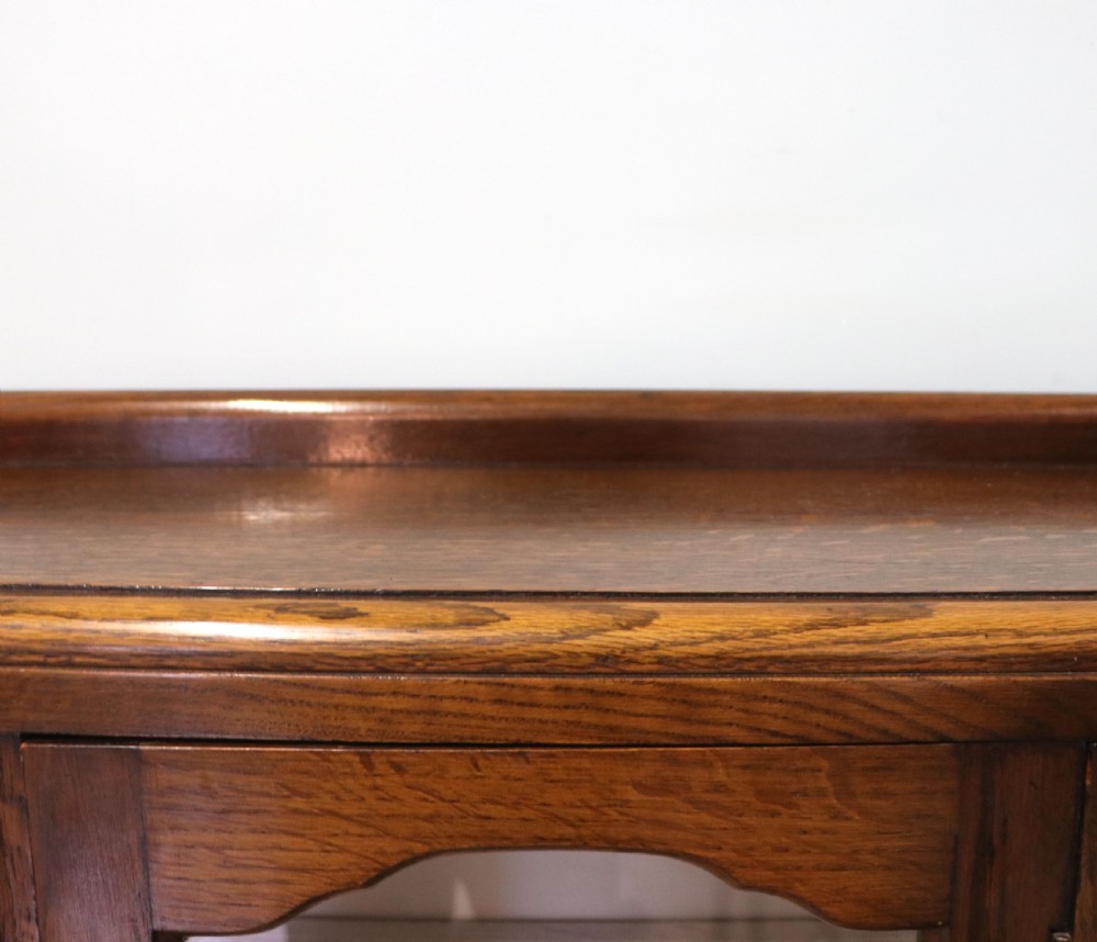  A lovely solid 1930s oak framed later sign written display cabinet. View VII