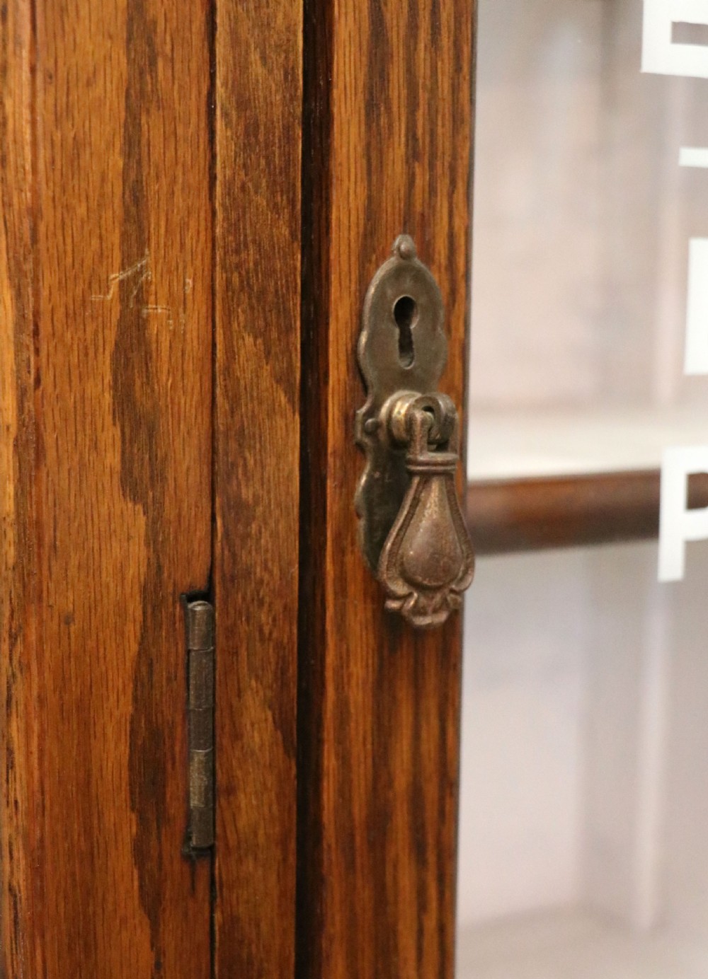  A lovely solid 1930s oak framed later sign written display cabinet. View XVII