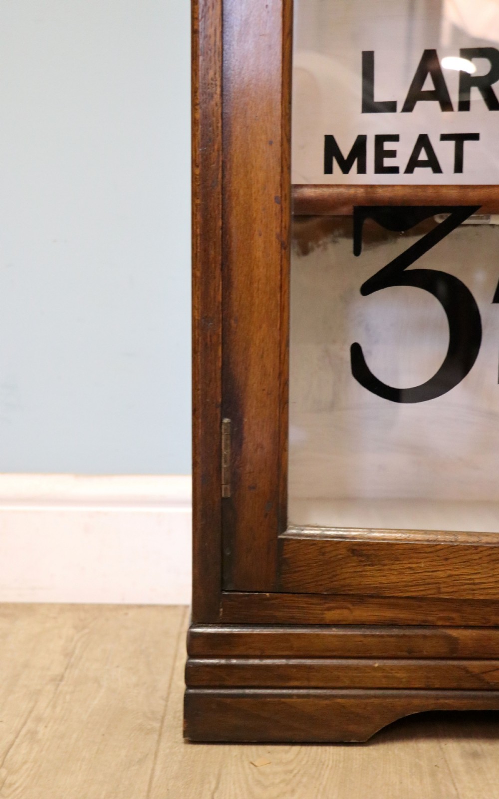  A lovely solid 1930s oak framed later sign written display cabinet. View XXIII