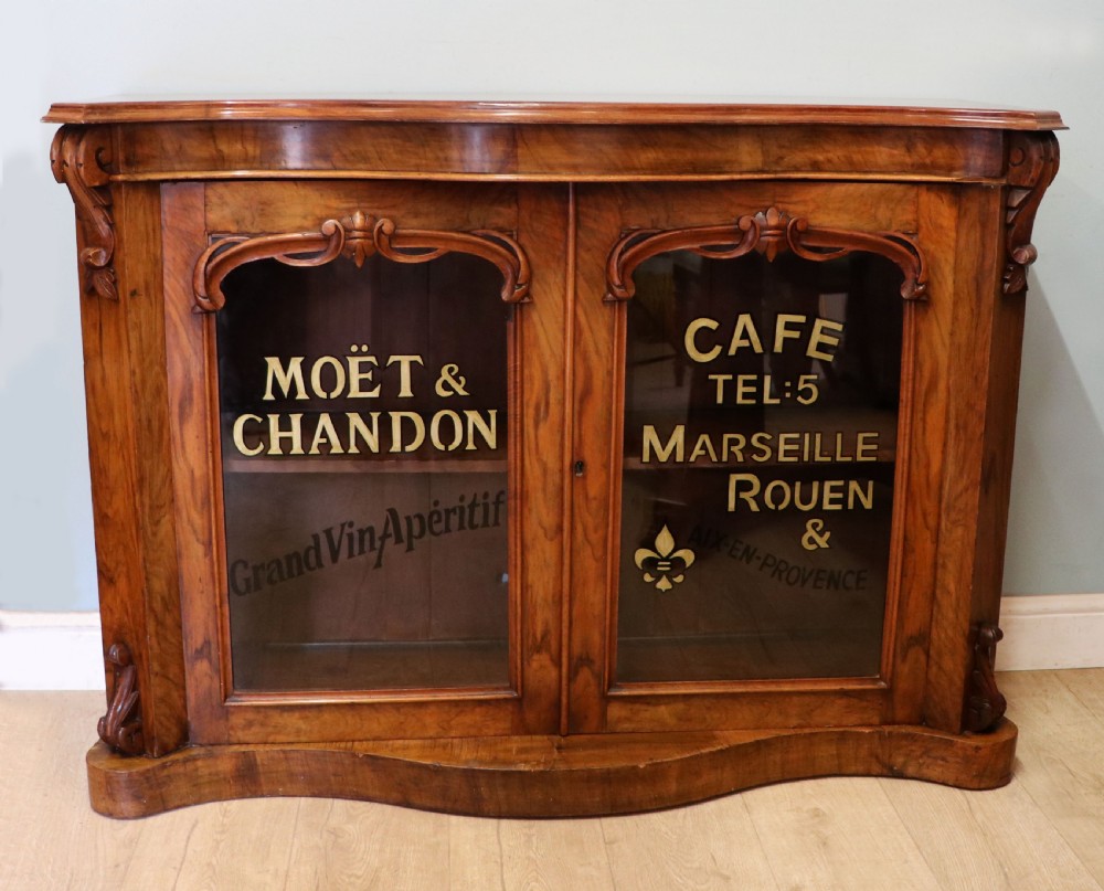  A lovely Victorian walnut & mahogany veneered sideboard of serpentine form.