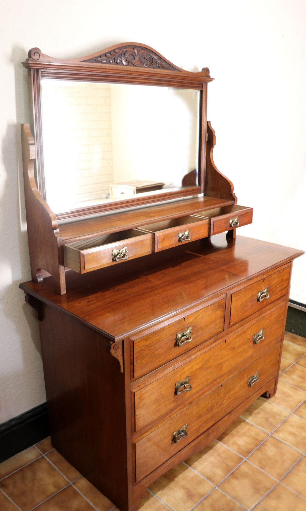 A late Victorian American walnut dressing chest. View III