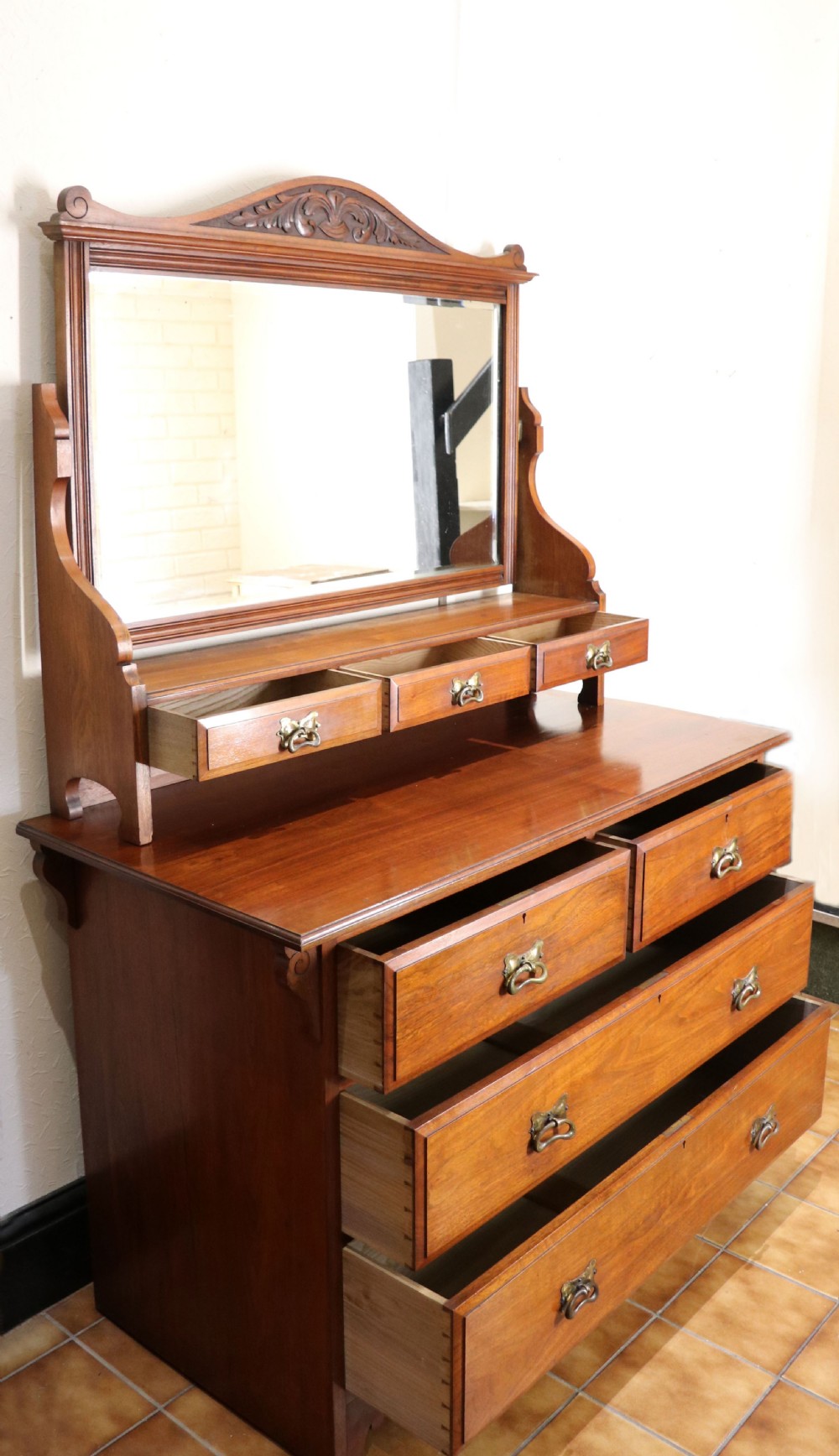A late Victorian American walnut dressing chest. View IV