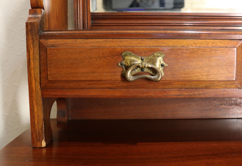 A late Victorian American walnut dressing chest. View VIII