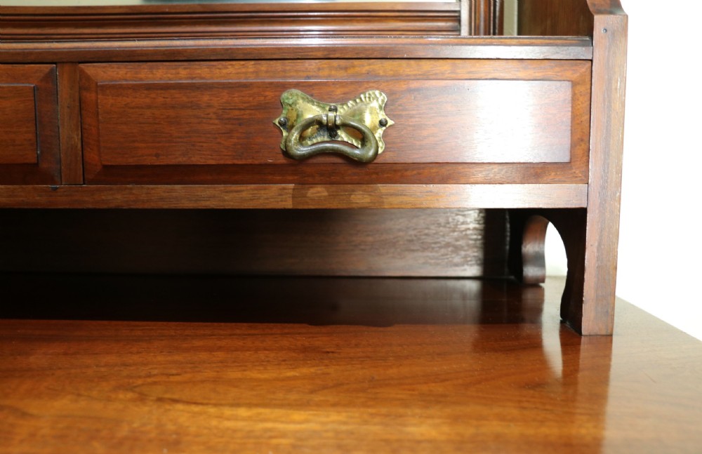 A late Victorian American walnut dressing chest. View XI