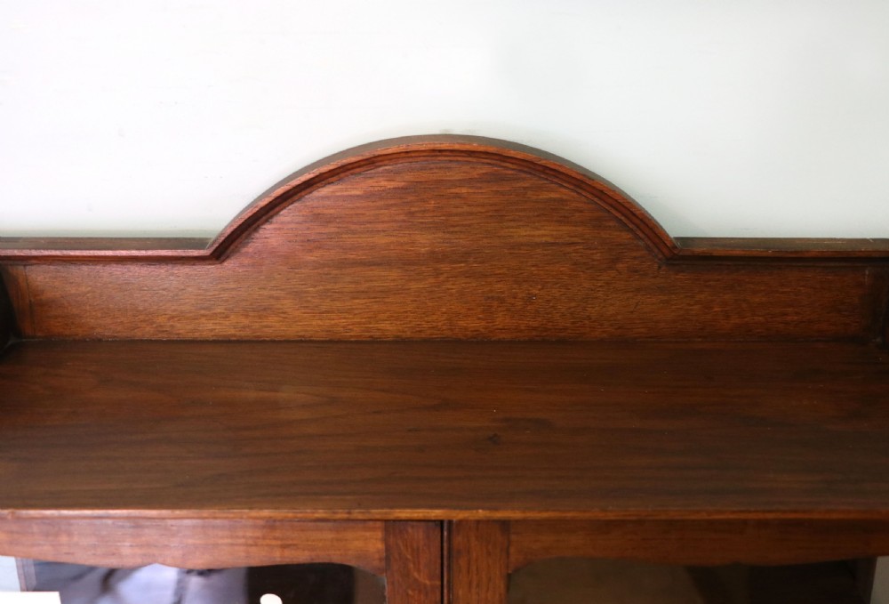  A wonderful Edwardian wall mounted solid oak framed display cabinet,  later sign written advertising Fry's Chocolate. View VI