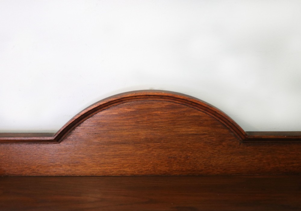  A wonderful Edwardian wall mounted solid oak framed display cabinet,  later sign written advertising Fry's Chocolate. View VII
