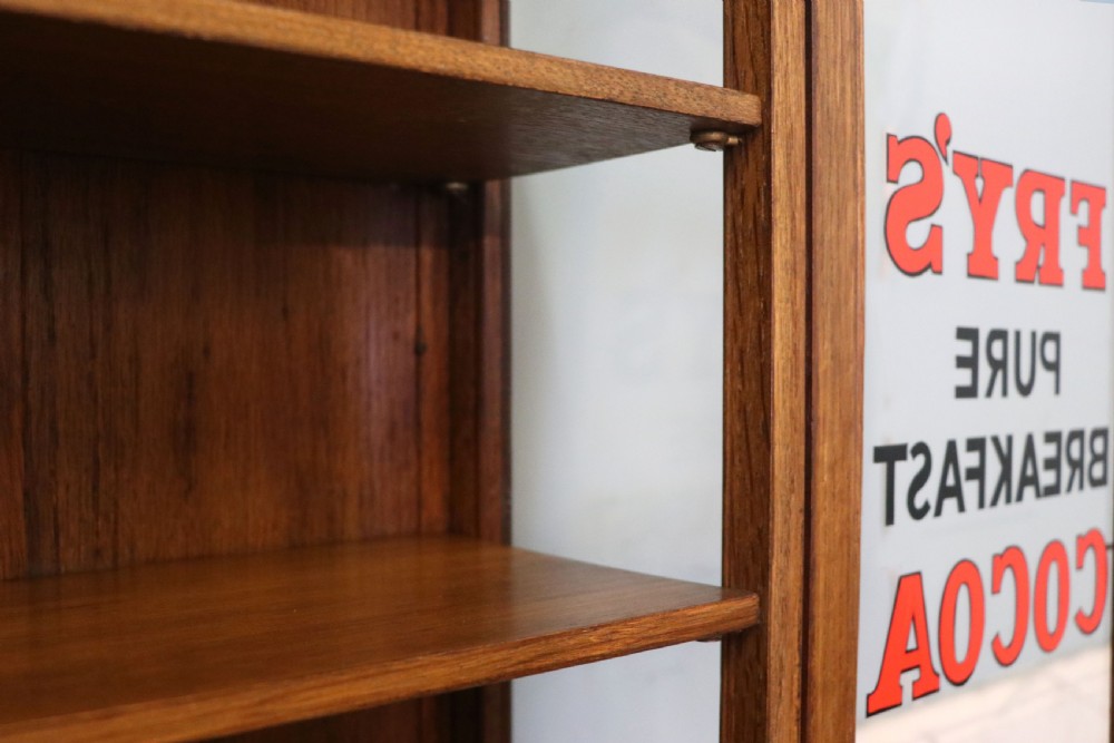  A wonderful Edwardian wall mounted solid oak framed display cabinet,  later sign written advertising Fry's Chocolate. View XVIII