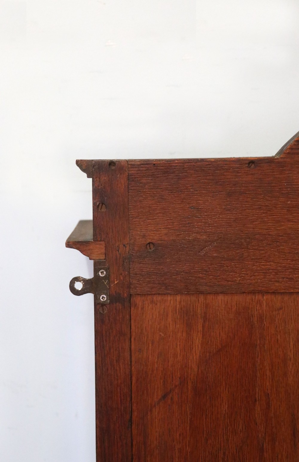  A wonderful Edwardian wall mounted solid oak framed display cabinet,  later sign written advertising Fry's Chocolate. View XXIV