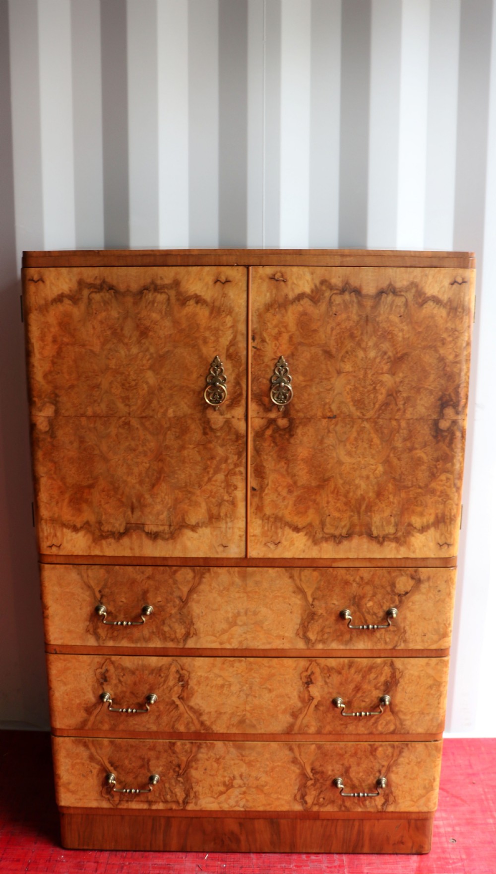 A 1930s burr walnut veneered tallboy cabinet. View II