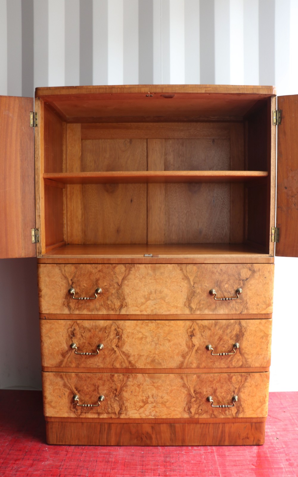 A 1930s burr walnut veneered tallboy cabinet. View III