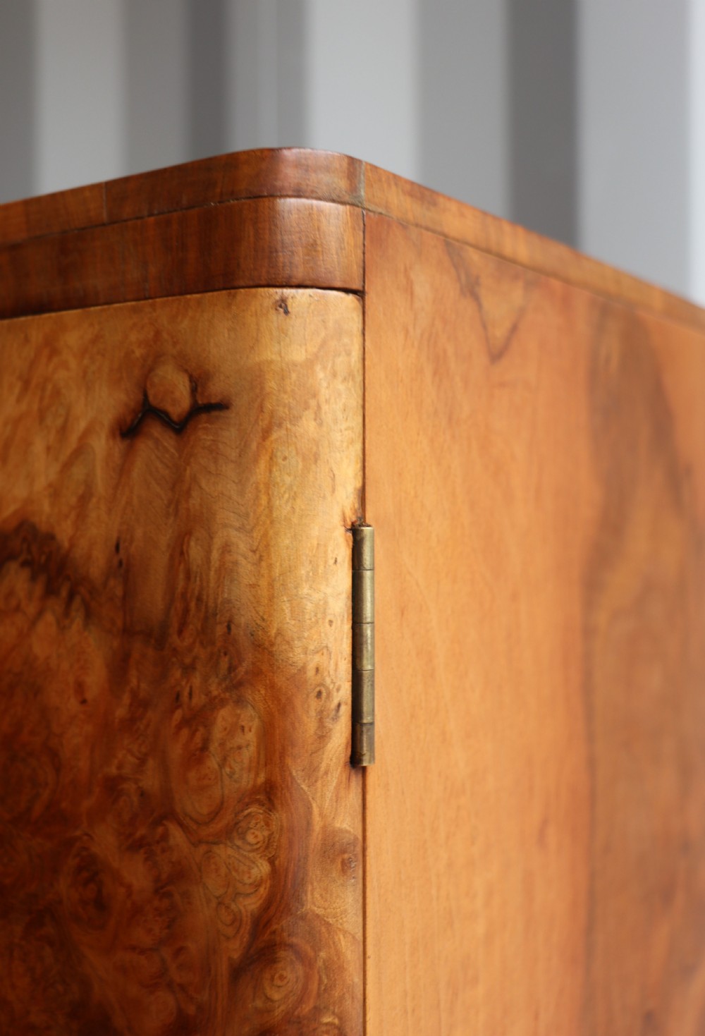A 1930s burr walnut veneered tallboy cabinet. View X