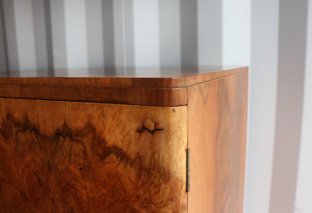 A 1930s burr walnut veneered tallboy cabinet. View XI
