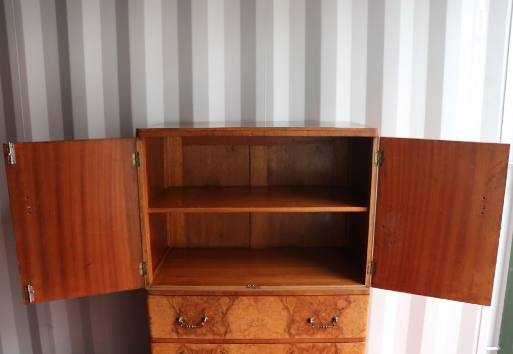 A 1930s burr walnut veneered tallboy cabinet. View XII
