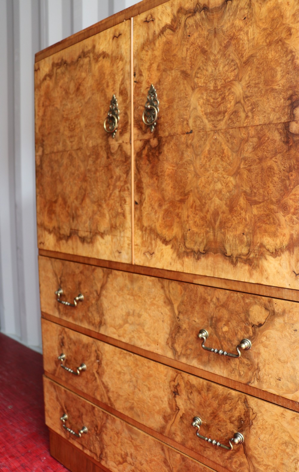 A 1930s burr walnut veneered tallboy cabinet. View XIV