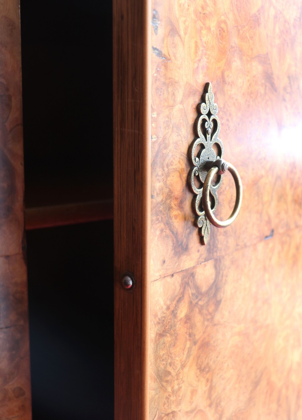 A 1930s burr walnut veneered tallboy cabinet. View XVIII