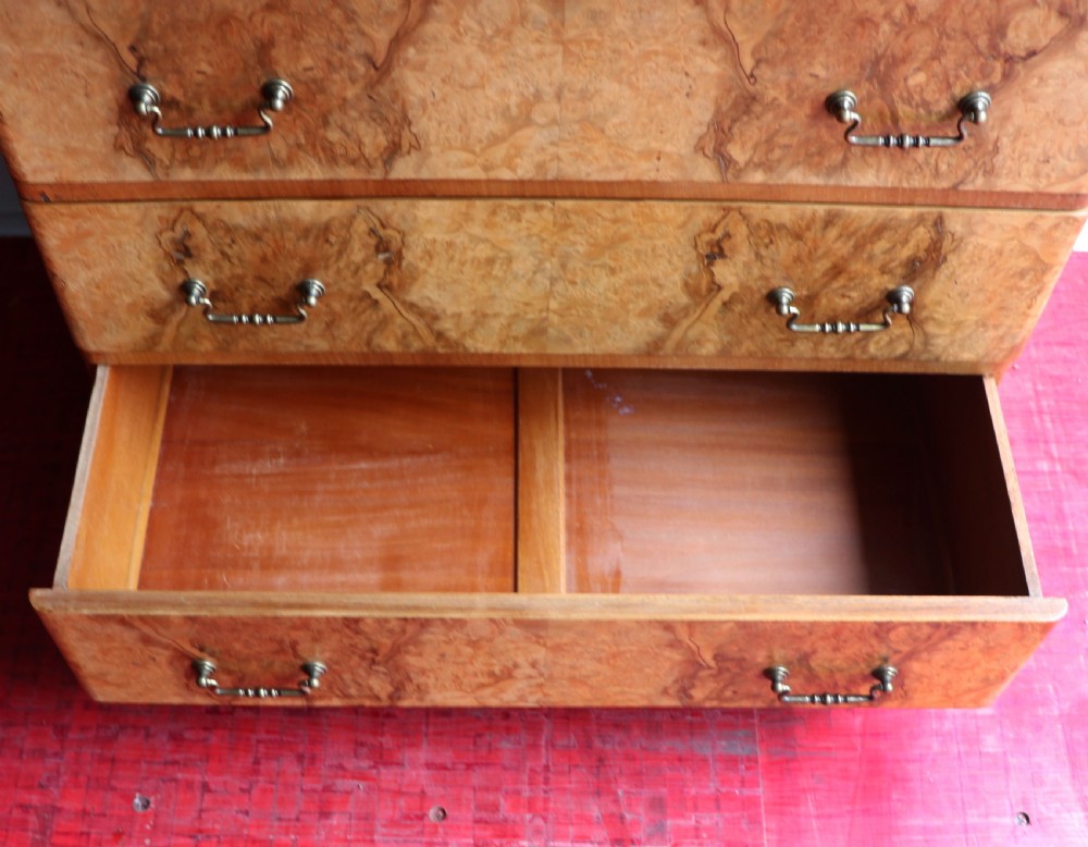 A 1930s burr walnut veneered tallboy cabinet. View XXII