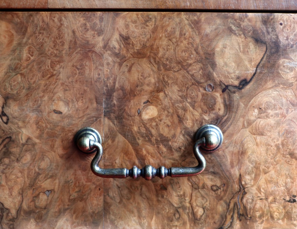 A 1930s burr walnut veneered tallboy cabinet. View XXIII