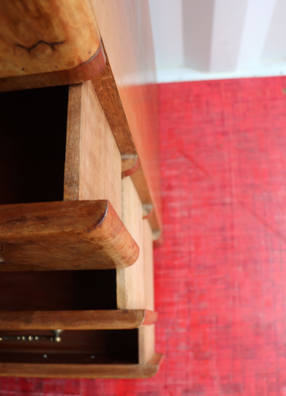 A 1930s burr walnut veneered tallboy cabinet. View XXVI