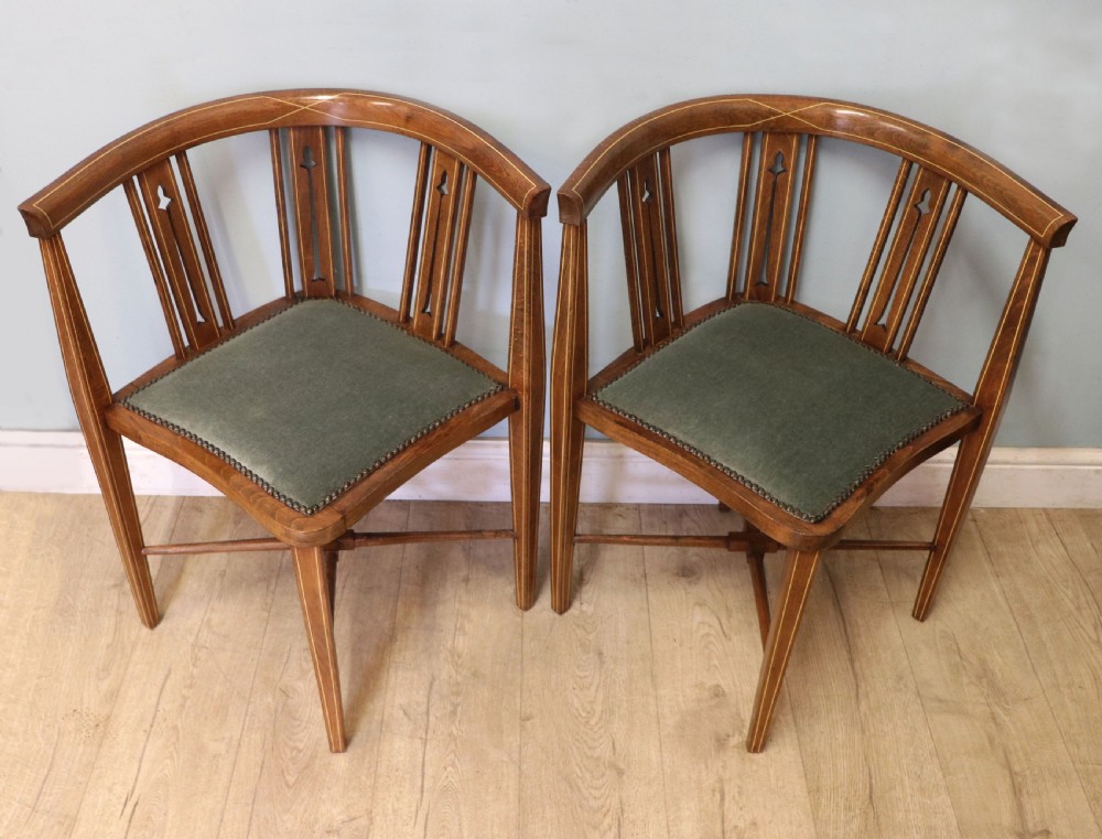 A pair of antique mahogany corner chairs featuring boxwood line inlay, pierced back splats, cross-braced legs, and green upholstered seats with stud trim. View II